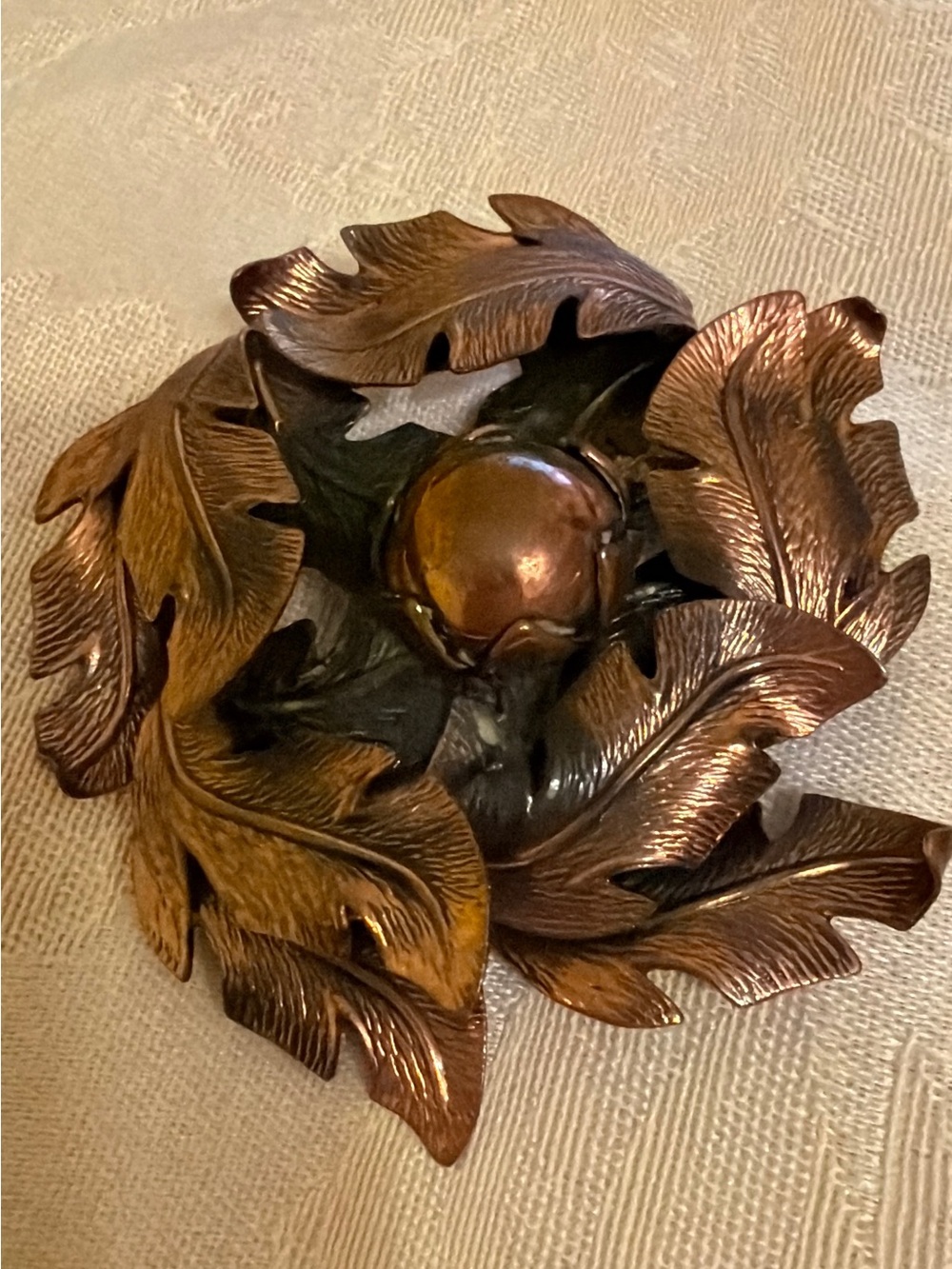 Solid Copper-Toned Metal flower Accent with Bell symbol